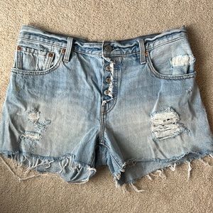 Distressed Levi Jean shorts